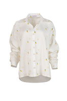 Estefania Camomille Ivory Mango button-down shirt with long sleeves and classic collar hanging on a hanger.