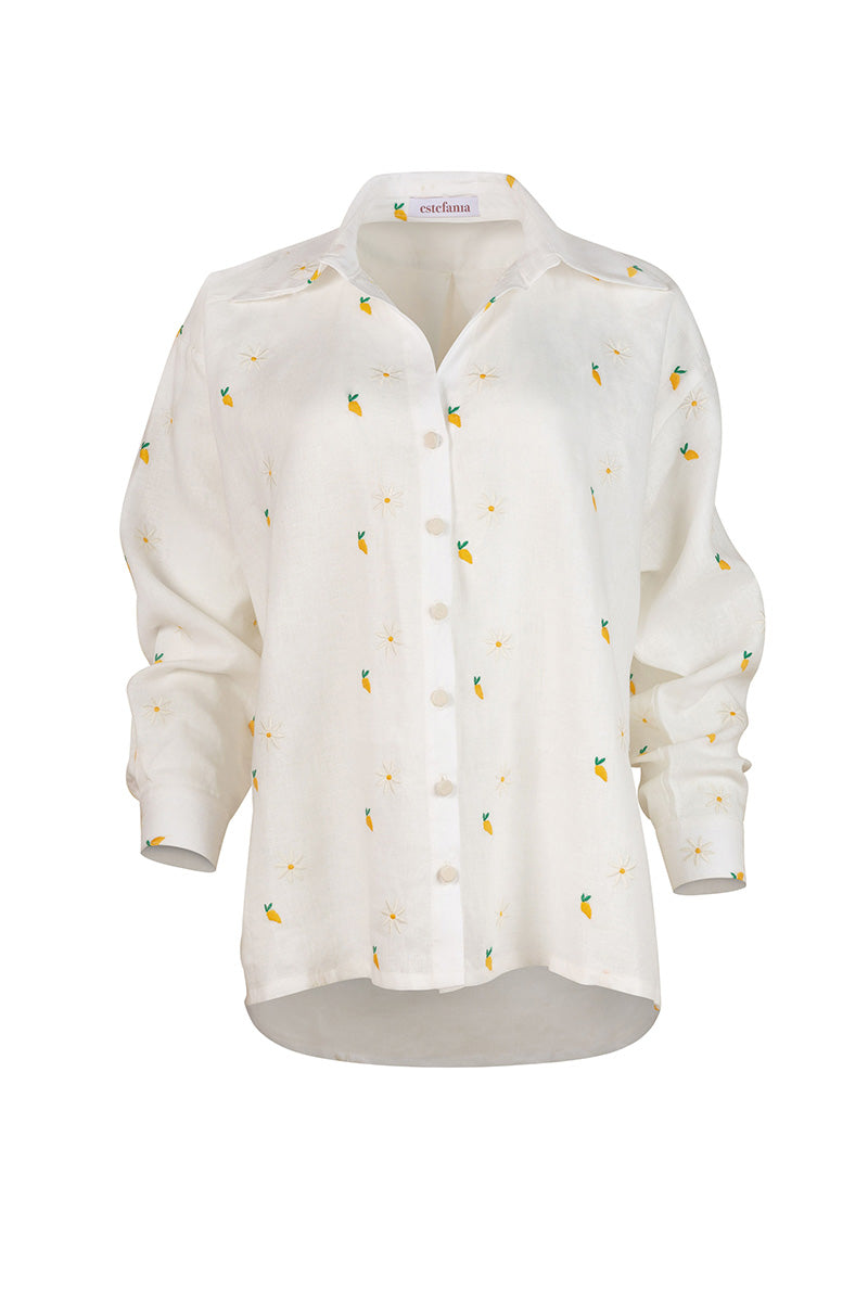Estefania Camomille Ivory Mango button-down shirt with long sleeves and classic collar hanging on a hanger.