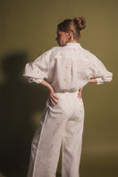 Estefania Camomille Ivory Mango button-down shirt featuring a classic collar and long sleeves, displayed on a hanger.
