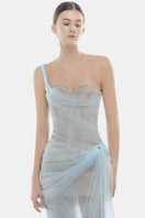 Elegant blue Mara gown by Montsand featuring flowing fabric and a stylish design, perfect for formal occasions.
