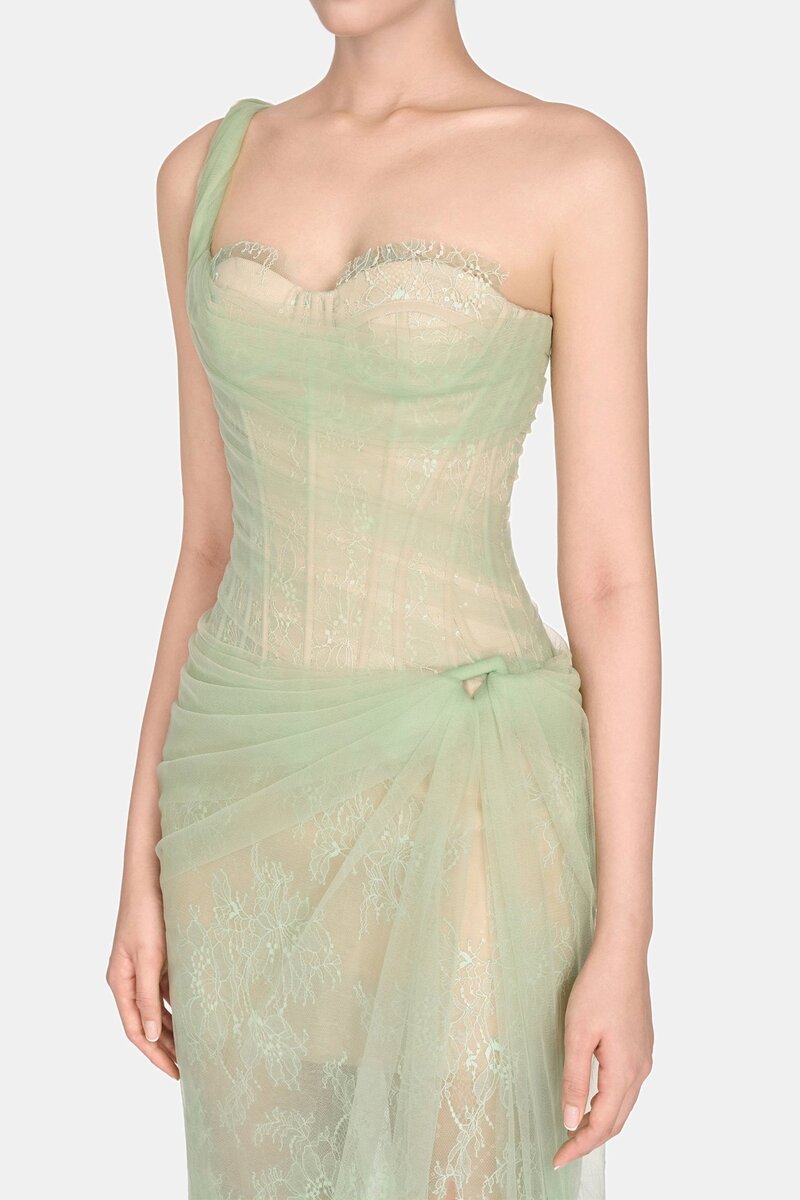 Mint-colored Mara gown by Montsand with elegant flowing fabric and sleeveless design, perfect for formal occasions.