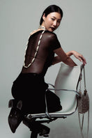 Silver shoulder bag by Silvia Gnecchi, THE MARAIS BAG in silver with sleek design and adjustable strap.