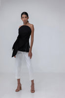 Black MAREA blouse by ANA + MARIA, stylish women's top with long sleeves and a relaxed fit, shown on a hanger.