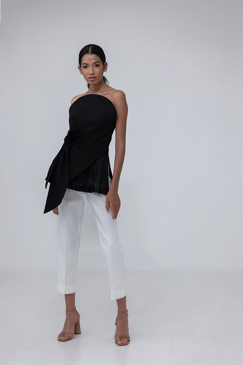 Black MAREA blouse by ANA + MARIA, stylish women's top with long sleeves and a relaxed fit, shown on a hanger.