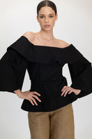 Black Marena blouse by ANA + MARIA, stylish tops with a relaxed fit and elegant neckline, shown on a model.