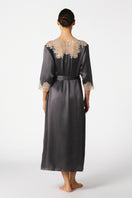 Elegant NK IMODE MARGAUX long silk robe in wet sand color, featuring a sophisticated, sensual design with smooth fabric and flowing silhouette.