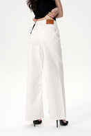 White Colette jeans by Nana Jacqueline, showcasing a slim fit with classic denim texture and stylish design.
