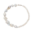 Elegant pearl necklace by Oz Objects featuring a classic design, perfect for sophisticated jewelry styling.