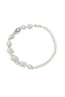 Elegant pearl necklace by Oz Objects featuring a classic design, perfect for sophisticated jewelry styling.