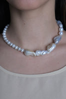 Elegant pearl necklace featuring the Maria Necklace in pearl by Oz Objects, showcasing a classic and sophisticated jewelry piece.