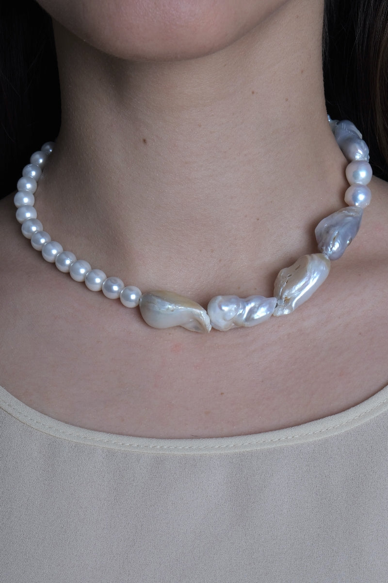 Elegant pearl necklace featuring the Maria Necklace in pearl by Oz Objects, showcasing a classic and sophisticated jewelry piece.
