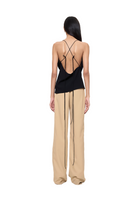 Back view of URA Marta Top in a stylish, fitted design, showcasing the neckline and fabric details.