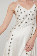 Mastani Arini embellished maxi dress with pearl details, flowing fabric, and elegant design for special occasions.