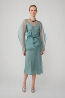 Light blue LIBA organza midi dress by Mastani, featuring elegant fabric and stylish design, perfect for special occasions.