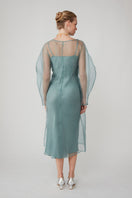 Elegant LIBA organza midi dress in Saxon blue by Mastani, featuring flowing fabric and a stylish, sophisticated design.