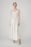 Mastani Arini embellished pearl maxi dress featuring intricate embroidery and elegant design, worn by a model.