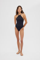 Black Maliluha Matutine one-piece swimsuit displayed on a mannequin, featuring a sleek and stylish design for beachwear.
