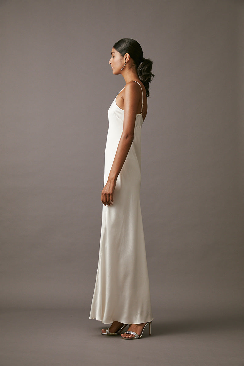 Elegant pearl maxi slip dress by MASTANI featuring a flowing fabric design, perfect for formal or special occasions.