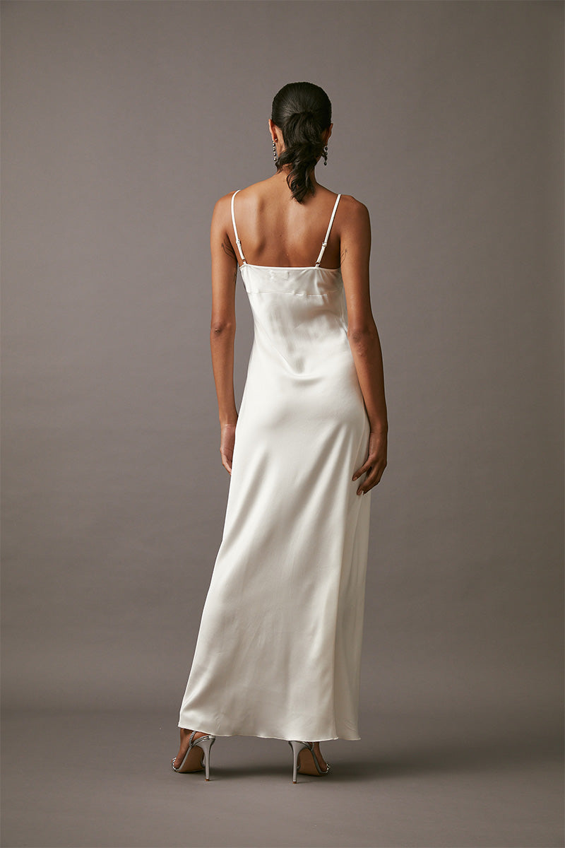 Elegant MASTANI maxi slip in pearl color, featuring a flowing design and lightweight fabric, perfect for formal occasions.