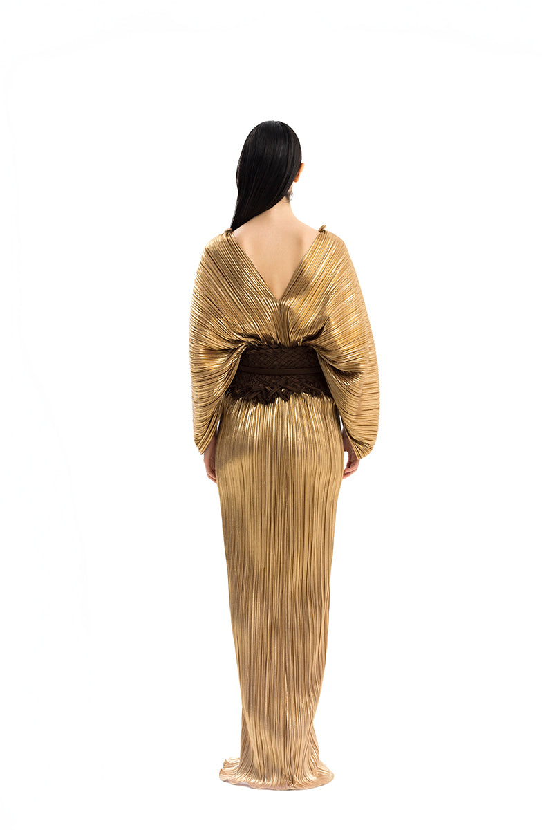 Elegant CANDELA dress gown by Maylé Vásquez, featuring flowing fabric and intricate design details, perfect for formal occasions.