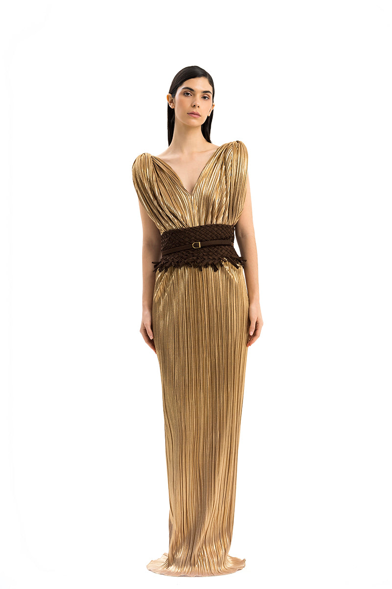 Elegant Candeia dress gown by Maylé Vásquez with intricate details and flowing fabric, perfect for formal occasions.