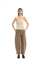 Maylé Vásquez INFINITO top in soft fabric, featuring a stylish neckline and fitted design, shown on a model.