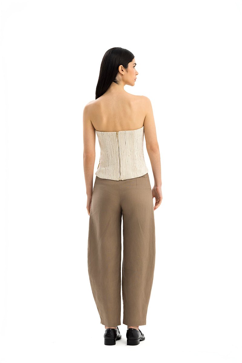 Maylé Vásquez INFINITO top, stylish women's blouse with elegant design, displayed on a hanger against a neutral background.