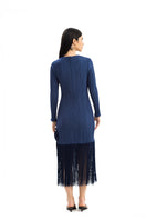 Maylé Vásquez RIO dress, a stylish midi dress with a flowing silhouette and vibrant pattern, perfect for casual or elegant occasions.