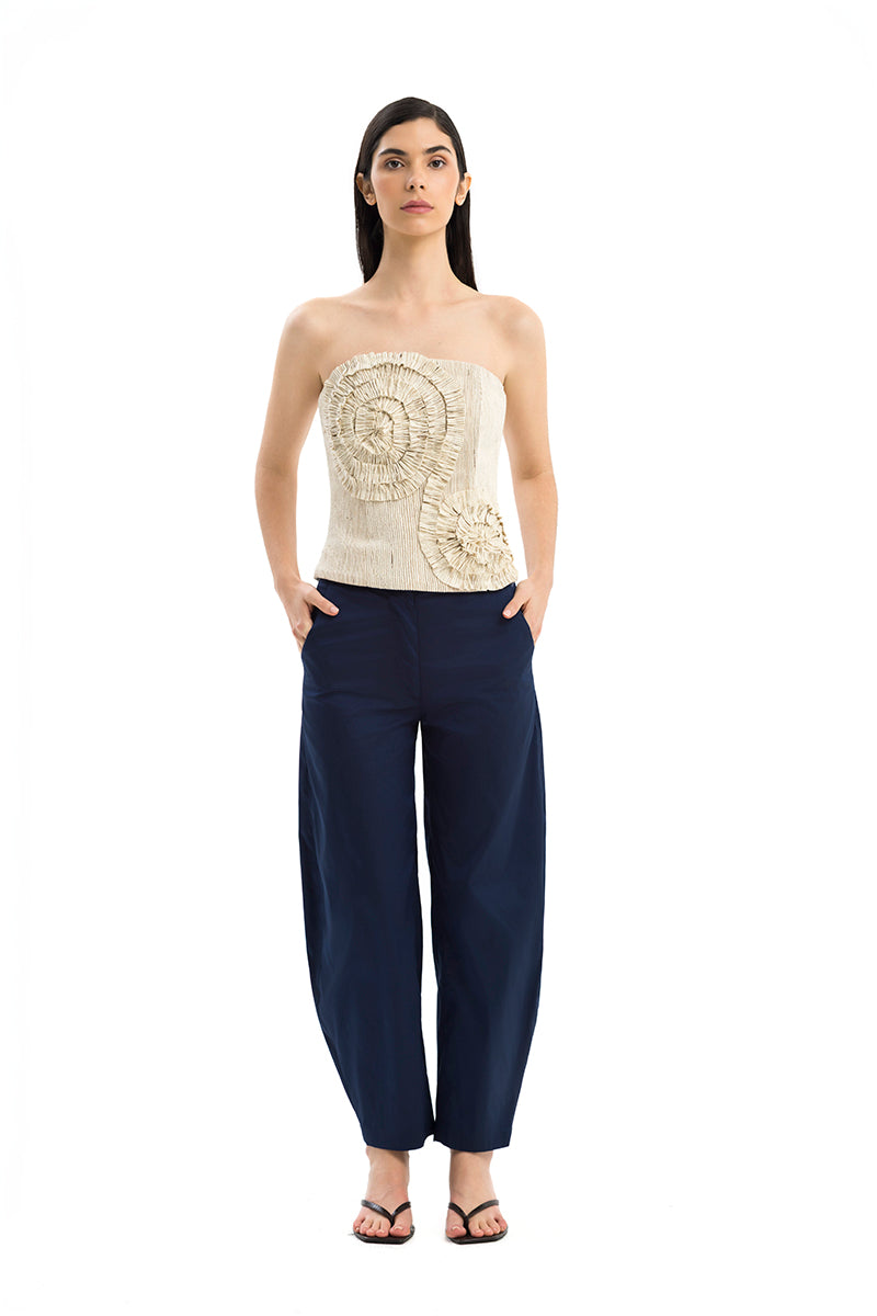 Maylé Vásquez Arena Pants in neutral fabric, featuring a relaxed fit and stylish design, shown in a front view.