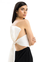 Maylé Vásquez Canela Two Tone Maxi Dress showing a flowing, stylish dress with contrasting fabric tones.