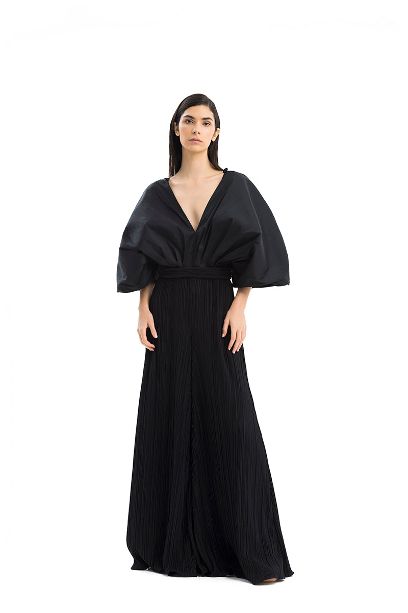Maylé Vásquez Sombra Palma jumpsuit displayed on a model, featuring a stylish, fitted design with a sleek, modern silhouette.