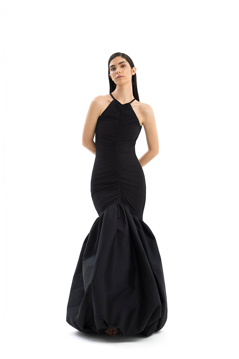 Elegant MENCIA gown by Maylé Vásquez featuring flowing fabric and intricate details, perfect for formal occasions.