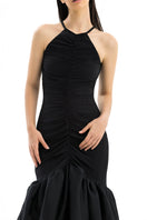 Elegant MENCIA gown by Maylé Vásquez featuring intricate lace details and a flowing silhouette.