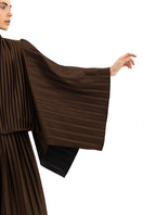 Brown COSTE NORTA jacket by Maylé Vásquez, shown in a stylish, tailored fit with front zipper and collar detail.