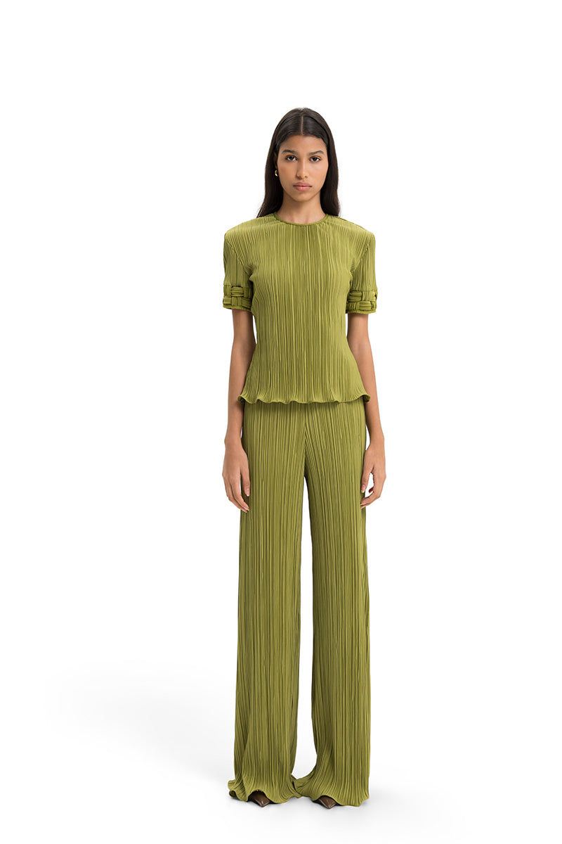 Maylé Vásquez SABIA top featuring a stylish design, showcased on a model with a close-up of fabric detail and vibrant color.