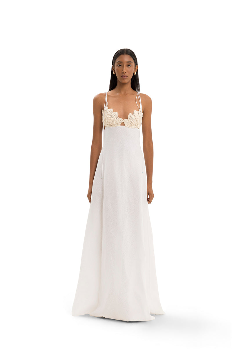 Elegant navy Conchita gown by Maylé Vásquez featuring a flowing silhouette and intricate detailing, perfect for formal occasions.