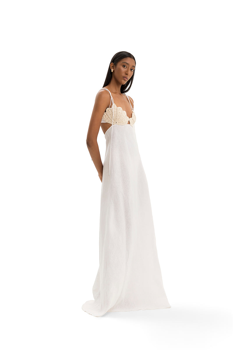 Elegant Conchita gown by Maylé Vásquez featuring flowing fabric and intricate detailing, perfect for formal occasions.