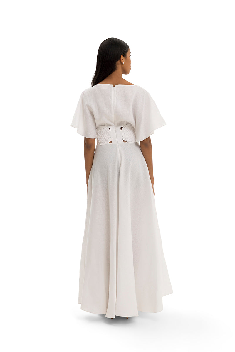 Elegant circle gown by Maylé Vásquez featuring flowing fabric and a stylish silhouette, perfect for formal occasions.