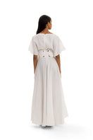 Elegant Maylé Vásquez circle gown with flowing fabric and intricate detailing, perfect for formal occasions.