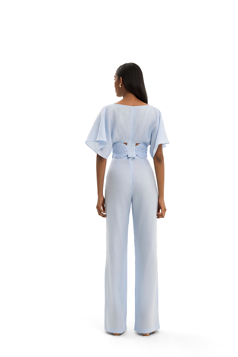 Maylé Vásquez Redondo Top featuring a fitted design with a round neckline and stylish details, shown on a model.