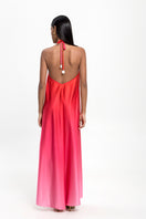Maylé Vásquez CANTO Maxi Dress displayed on a hanger, showcasing its flowing fabric and elegant design for women.