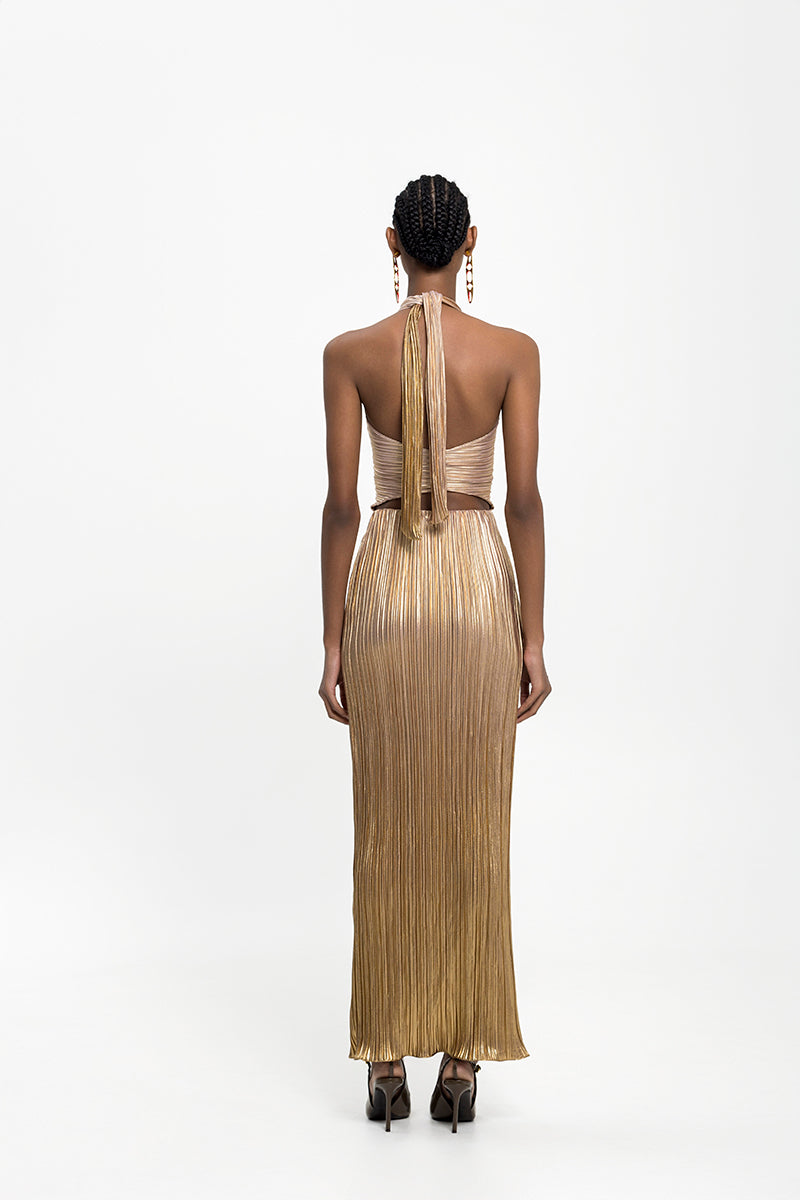 Maylé Vásquez DORADO Maxi Dress featuring flowing fabric and vibrant gold color, perfect for elegant summer occasions.