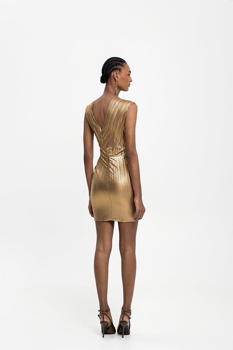 Maylé Vásquez ORO mini dress showing a stylish short dress with elegant design and fabric detail.