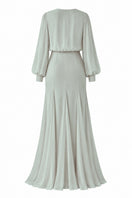 Green Nihan Peker MAYSA gown with elegant draping and long sleeves, perfect for formal occasions.