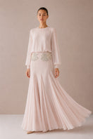 Light pink Nihan Peker Maysa gown with elegant flowy fabric and intricate detailing, perfect for formal occasions.