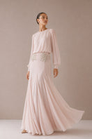 Light pink Nihan Peker Maysa gown with elegant flowy fabric and intricate design, perfect for formal occasions.