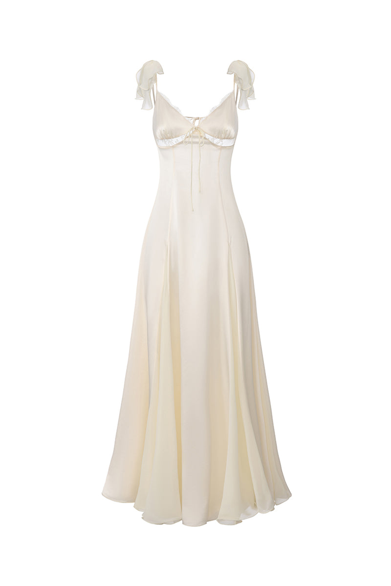 Nana Jacqueline Meadow maxi dress with open back and champagne color, flowing fabric ideal for elegant summer occasions.