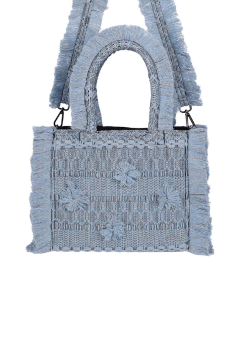 Medium Bani Poka Balay top handle bag with sleek design and sturdy handles, shown in a stylish, neutral-toned fabric.