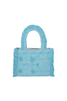Bani Medium Poka Bali top handle bag in natural woven material with rounded shape and sturdy leather handles.