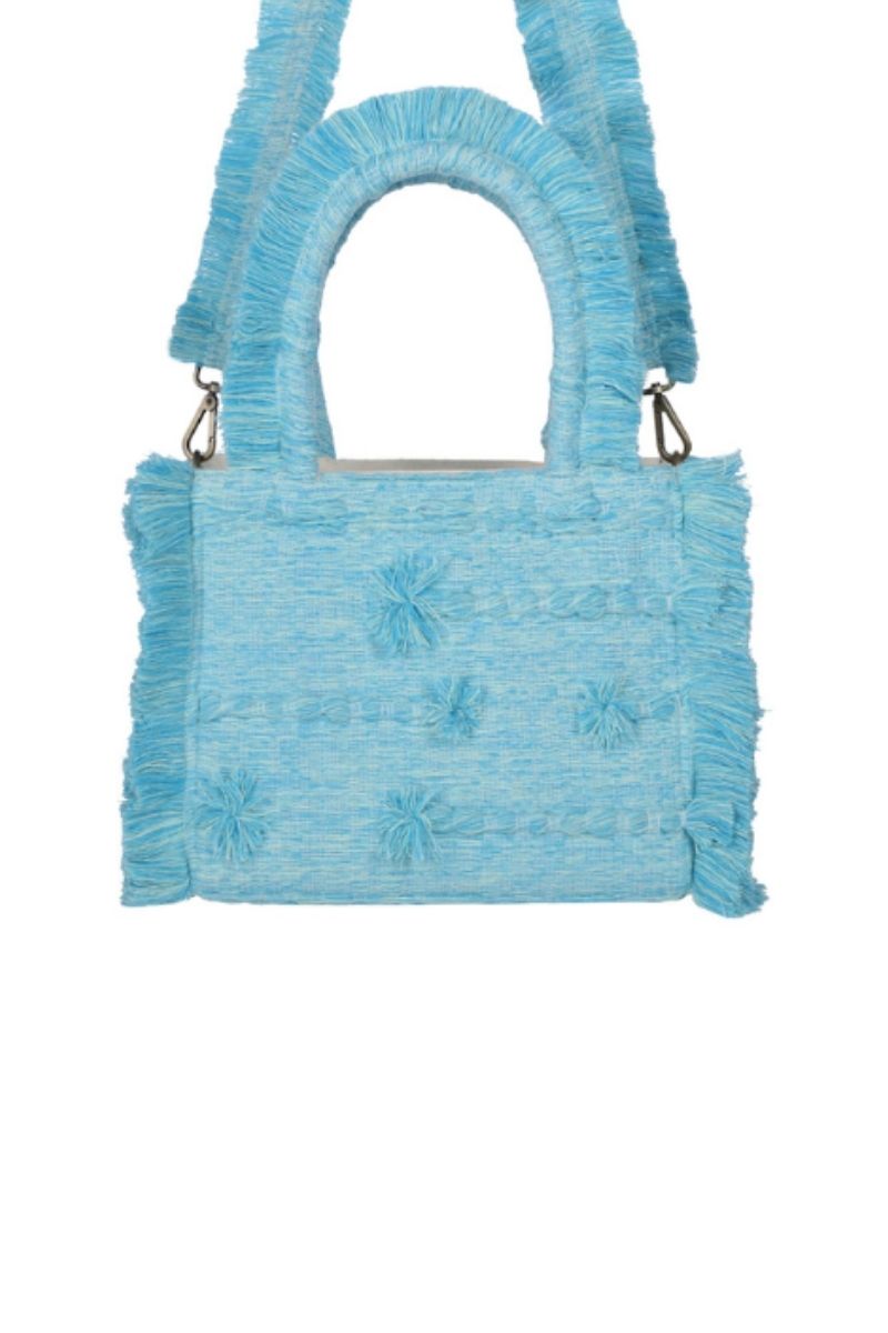 Medium Poka Bali top handle bag by Bani featuring a stylish woven design and sturdy handle on a neutral background.